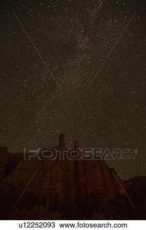 Stock Image - Night sky above rocks. Fotosearch