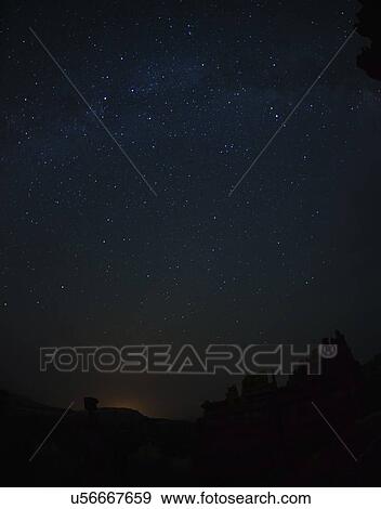 Stock Photo - Night sky above rocks. Fotosearch