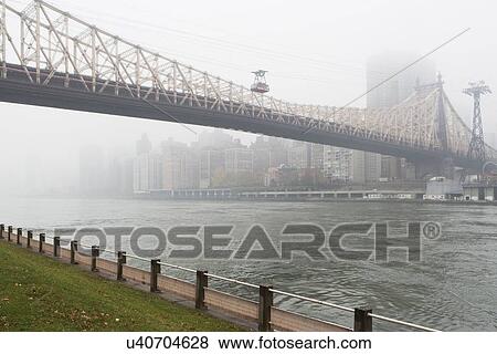 Stock Photo - Overhead cable car by Queensboro Bridge. Fotosearch
