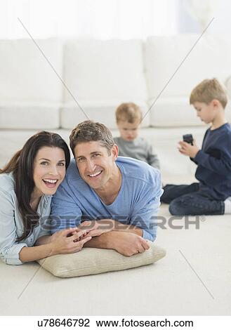 Parents with kids (12-17 months, 6-7) at home View Large Photo Image Stock Image - Parents with kids (12-17 months, 6-7) at home. Fotosearch
