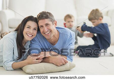 Parents with kids (12-17 months, 6-7) at home View Large Photo Image Stock Photograph - Parents with kids (12-17 months, 6-7) at home. Fotosearch