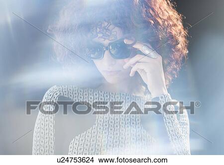 Portrait of beautiful woman wearing sunglasses View Large Photo Image Picture - Portrait of beautiful woman wearing sunglasses. Fotosearch