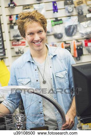 Portrait of bike shop assistant View Large Photo Image Stock Image - Portrait of bike shop assistant. Fotosearch
