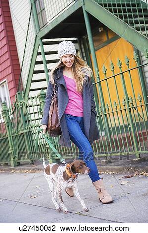 Portrait of blond woman walking dog View Large Photo Image Stock Image - Portrait of blond woman walking dog. Fotosearch