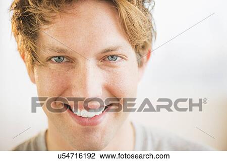 Stock Image - Portrait of blue-eyed man. Fotosearch
