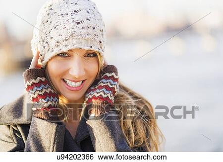 Stock Photograph - Portrait of bundled woman . Fotosearch