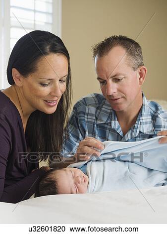 Portrait of family with newborn baby boy (0-11 months) View Large Photo Image Stock Image - Portrait of family with newborn baby boy (0-11 months). Fotosearch