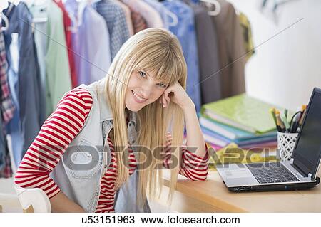 Portrait of female creative professional with laptop in studio View Large Photo Image Stock Image - Portrait of female creative professional with laptop in studio. Fotosearch