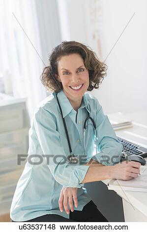 Stock Photo - Portrait of female doctor. Fotosearch