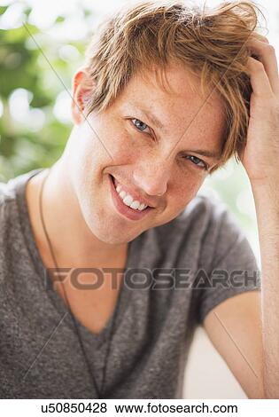 Stock Photo - Portrait of man smiling. Fotosearch