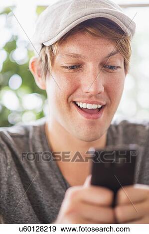 Portrait of man using phone View Large Photo Image Stock Photo - Portrait of man using phone. Fotosearch