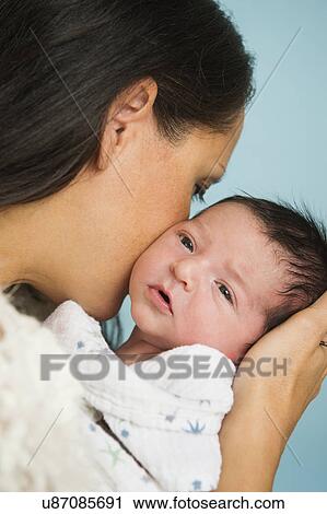 Portrait of mother holding newborn baby (0-11 months) View Large Photo Image Stock Image - Portrait of mother holding newborn baby (0-11 months). Fotosearch