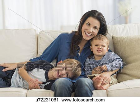 Portrait of mother with two sons (12-17 months, 6-7) View Large Photo Image Stock Image - Portrait of mother with two sons (12-17 months, 6-7). Fotosearch