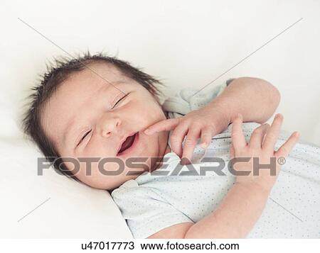 Stock Image - Portrait of newborn baby boy (0-1 months). Fotosearch
