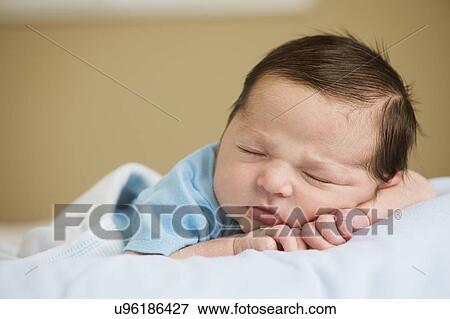 Portrait of newborn baby boy (0-1 months) sleeping View Large Photo Image Stock Photo - Portrait of newborn baby boy (0-1 months) sleeping. Fotosearch