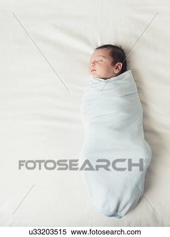 Stock Photography - Portrait of newborn baby boy (0-1 months). Fotosearch