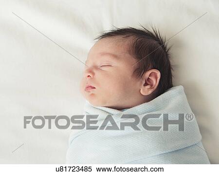 Stock Photography - Portrait of newborn baby boy (0-1 months). Fotosearch