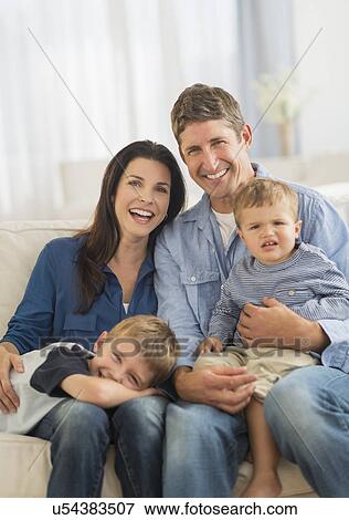 Portrait of parents with two sons (12-17 months, 6-7) View Large Photo Image Stock Photo - Portrait of parents with two sons (12-17 months, 6-7). Fotosearch