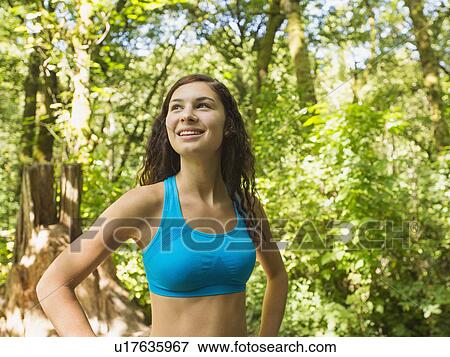 Stock Photo - Portrait of runner in forest. Fotosearch