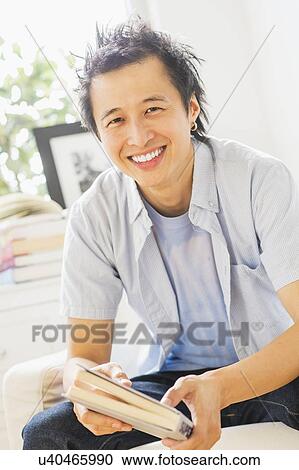 Portrait of teenage boy (16-17) reading book View Large Photo Image Stock Image - Portrait of teenage boy (16-17) reading book. Fotosearch