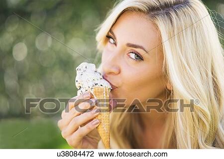 Portrait of teenage girl (16-17) eating ice cream View Large Photo Image Stock Image - Portrait of teenage girl (16-17) eating ice cream. Fotosearch