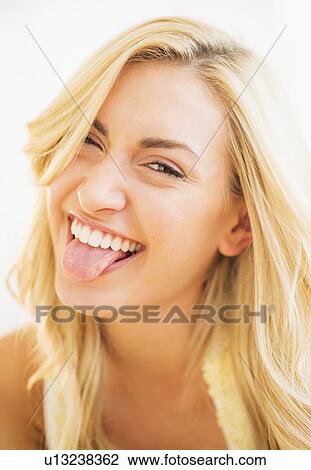 Portrait of teenage girl (16-17) sticking tongue out View Large Photo Image Stock Image - Portrait of teenage girl (16-17) sticking tongue out. Fotosearch