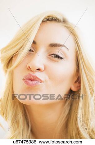 Portrait of teenage girl (16-17) blowing kiss View Large Photo Image Stock Photograph - Portrait of teenage girl (16-17) blowing kiss. Fotosearch