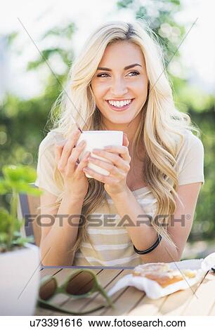 Portrait of teenage girl (16-17) drinking coffee View Large Photo Image Stock Photograph - Portrait of teenage girl (16-17) drinking coffee . Fotosearch