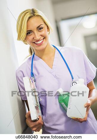 Stock Image - Portrait of teenage nurse (16-17). Fotosearch