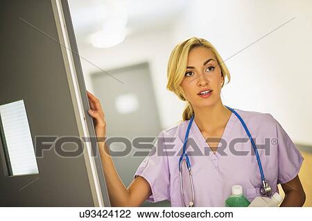 Stock Image - Portrait of teenage nurse (16-17). Fotosearch