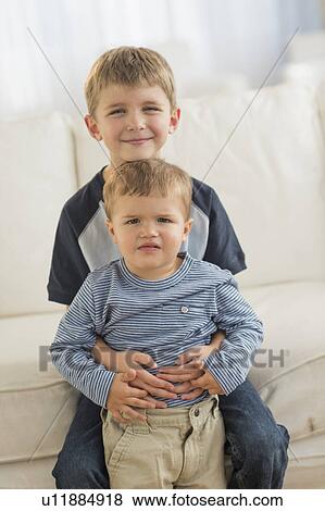 Portrait of two brothers (12-17 months, 6-7) View Large Photo Image Stock Photo - Portrait of two brothers (12-17 months, 6-7). Fotosearch