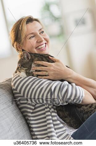 Portrait of woman holding cat View Large Photo Image Stock Photograph - Portrait of woman holding cat. Fotosearch