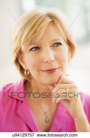 Stock Photo - Portrait of woman smiling. Fotosearch