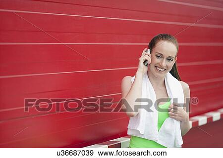 Portrait of woman talking on mobile View Large Photo Image Stock Photo - Portrait of woman talking on mobile. Fotosearch