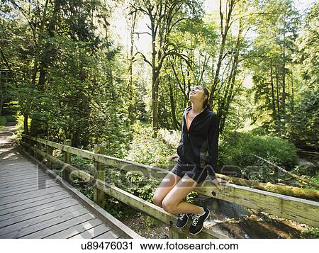 Portrait of young woman resting after exercising View Large Photo Image Stock Image - Portrait of young woman resting after exercising. Fotosearch