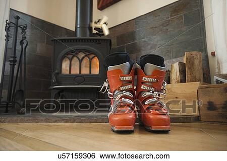 Ski boots drying in front of fireplace View Large Photo Image Stock Photograph - Ski boots drying in front of fireplace. Fotosearch