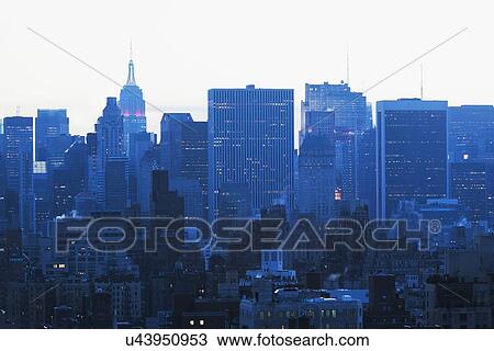 Stock Image - Skyline at dusk. Fotosearch
