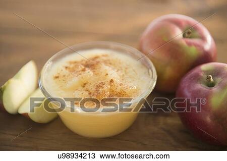 Stock Image - Studio Shot of apple sauce and apples. Fotosearch