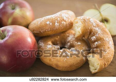 Picture - Studio Shot of donuts and apples. Fotosearch