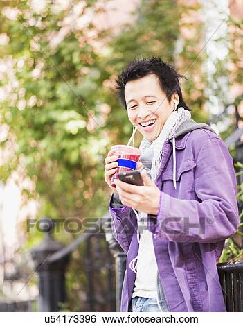 Teenage boy (16-17) drinking smoothie View Large Photo Image Stock Photograph - Teenage boy (16-17) drinking smoothie. Fotosearch