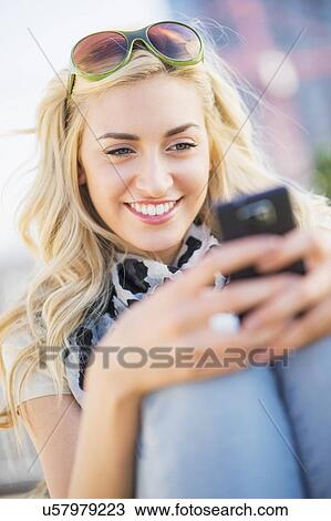 Teenage girl (16-17) using cell phone View Large Photo Image Stock Image - Teenage girl (16-17) using cell phone. Fotosearch
