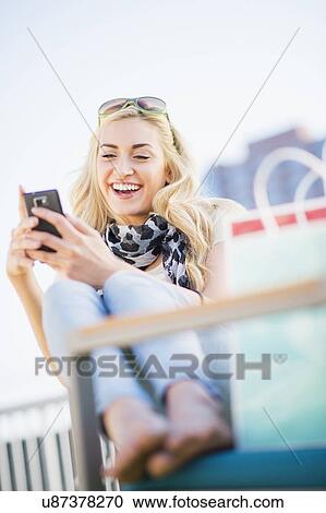 Teenage girl (16-17) using cell phone View Large Photo Image Stock Image - Teenage girl (16-17) using cell phone. Fotosearch
