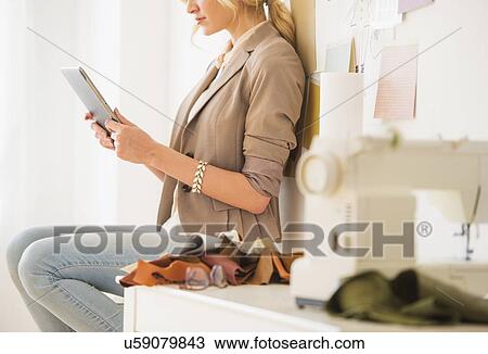 Teenage girl (16-17) using digital tablet, mid-section View Large Photo Image Stock Image - Teenage girl (16-17) using digital tablet, mid-section. Fotosearch