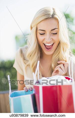 Teenage girl (16-17) with shopping bags View Large Photo Image Stock Photo - Teenage girl (16-17) with shopping bags. Fotosearch