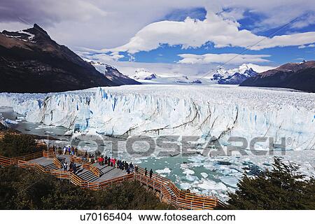 Tourists looking at glacier View Large Photo Image Picture - Tourists looking at glacier. Fotosearch