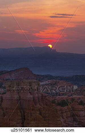 Stock Image - View of rocks at sunset. Fotosearch