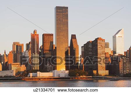 Stock Image - View of skyline at sunset. Fotosearch