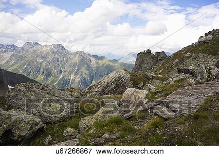 Stock Photo - View to rock formations of European Alps. Fotosearch