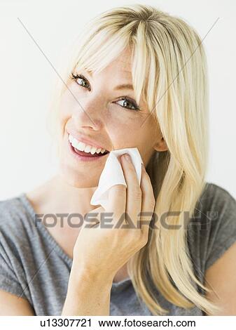 Stock Image - Woman cleaning face. Fotosearch