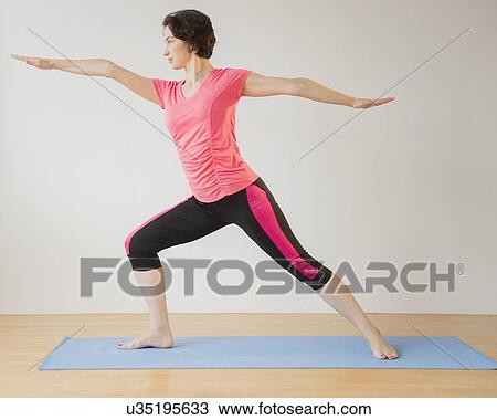 Woman doing yoga View Large Photo Image Stock Image - Woman doing yoga. Fotosearch